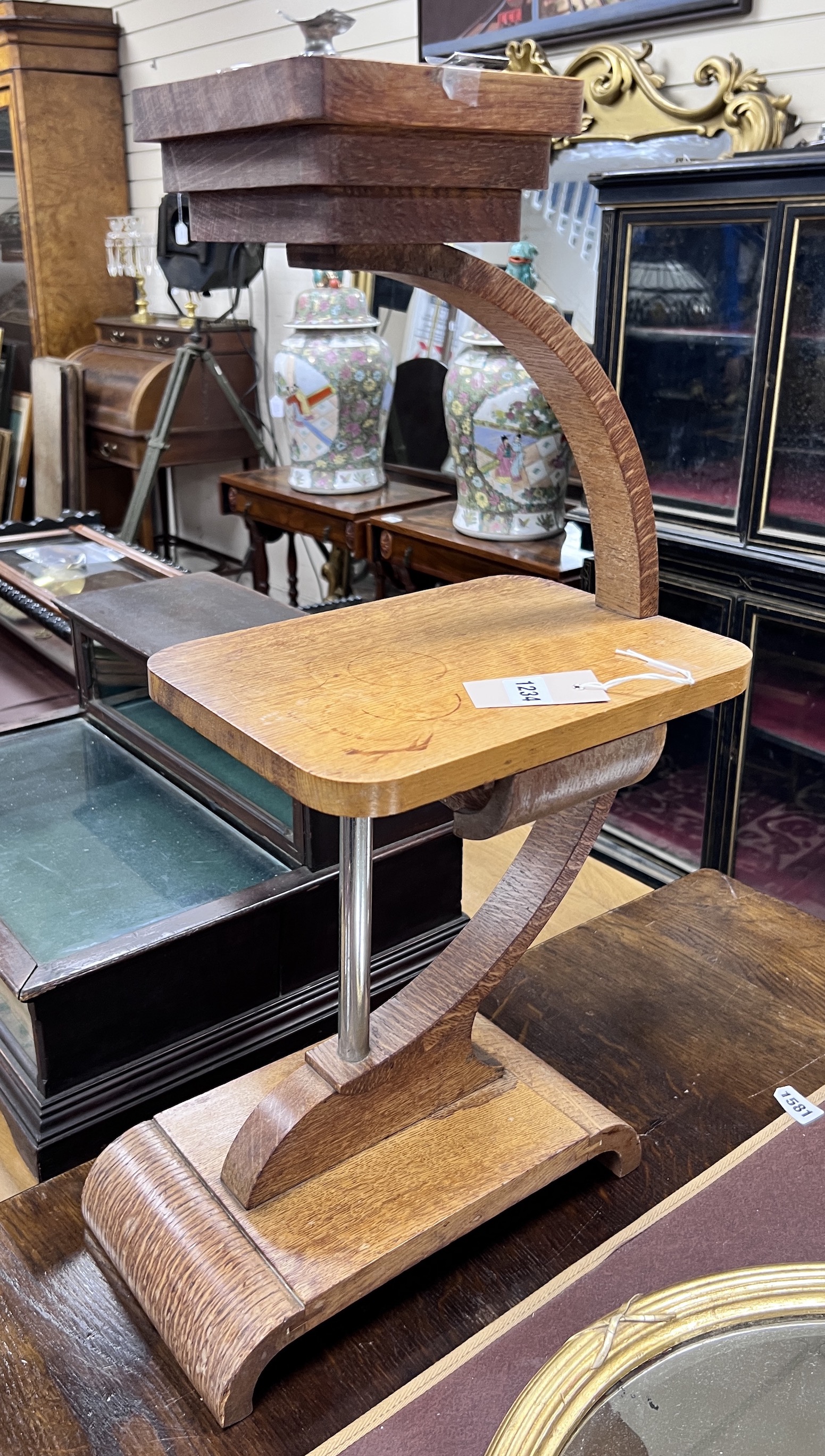 An Art Deco oak smoker's stand, height 65cm